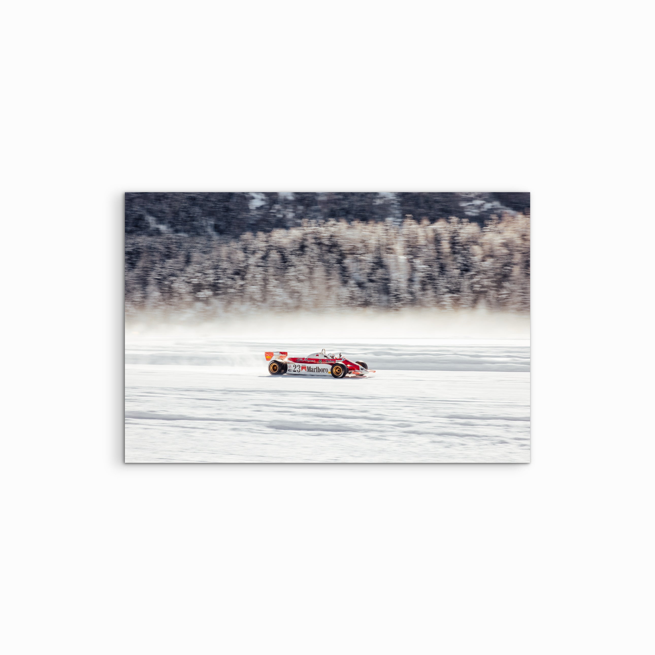 This panning shot captures a surreal collision of elements: a 1979 Alfa Romeo 179B F1 car tearing across the frozen Lake St. Moritz. At nearly 83, the legendary Arturo Merzario, the "Cowboy" of the paddock, is at the wheel. The photographic precision perfectly freezes the iconic beast in motion, blurring the alpine backdrop into a streak of speed. Despite the 500hp engine losing its tire socks, this frame immortalizes a rare moment where racing heritage meets the winter chill.