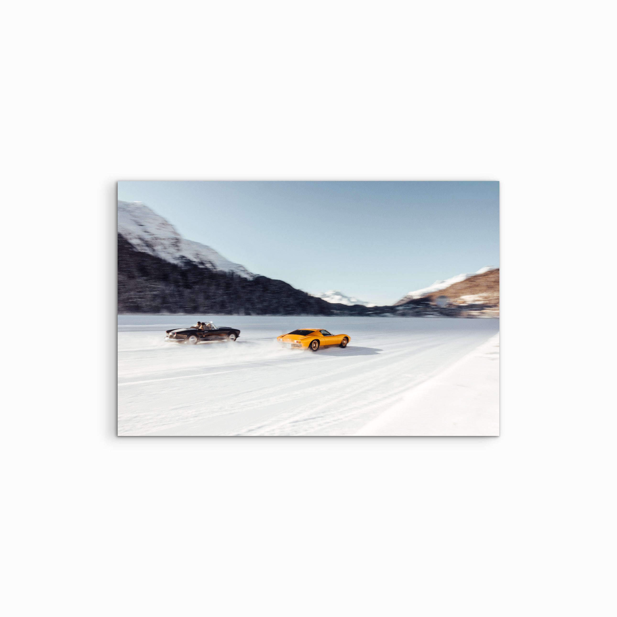 In this dynamic action shot from The I.C.E. St. Moritz 2026, a vibrant yellow Lamborghini Miura SV is locked in a high-speed duel with a classic Ferrari 250 GT Cabriolet across the frozen lake.
While the Miura SV stood out as a highlight of the "Icons on Wheels" class, its presence on the ice alongside a 1960s Ferrari contemporary perfectly illustrates the historic rivalry between Sant'Agata and Maranello. This frame captures the absolute pinnacle of Italian automotive engineering, transformed into moving a
